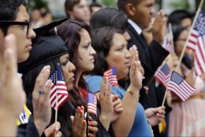 DREAMers (Development, Relief, and Education for Alien Minors) and parents take an oath in a mock citizenship ceremony during a "United we Dream," rally on Capitol Hill in Washington, Wednesday, July 10, 2013. (AP Photo/Alex Brandon)