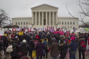 A crowd gathers outside the Supreme Court in Washington, Wednesday, March 4, 2015, as the court hears arguments in King v. Burwell. (AP Photo/Pablo Martinez Monsivais)