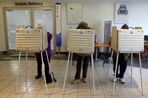 Voters cast their ballots at a polling place in a car dealership on Super Tuesday in Chicago in this Feb. 5, 2008 photo. (AP Photo/Jerry Lai)