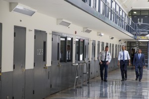 President Barack Obama is led on a tour by Bureau of Prisons Director Charles Samuels, right, and correctional officer Ronald Warlick during a visit to the El Reno Federal Correctional Institution, in El Reno, Okla., Thursday, July 16, 2015. (AP Photo/Evan Vucci)