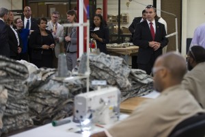 Attorney General Loretta Lynch takes a tour of a factory during a visit to the Talladega Federal Correctional Institution in Talladega, Ala., Friday, April 29, 2016, to highlight policies that aim to reduce barriers for formerly incarcerated individuals. (AP Photo/Evan Vucci)