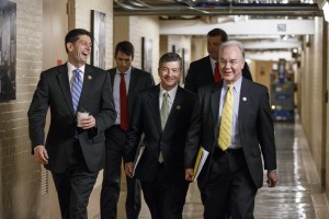 Front row, from left, Speaker of the House Paul Ryan, R-Wis., House Financial Services Committee Chairman Rep. Jeb Hensarling, R-Texas, and Secretary of Health and Human Services nominee Tom Price, R-Ga., walk through a basement corridor on Capitol Hill in Washington. (AP Photo/J. Scott Applewhite)