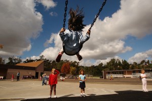 Student on swing set