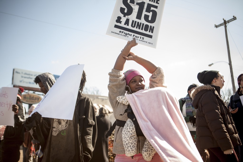 Marquisha McKinley and her daughter in the Fight for $15 strike line outside a McDonald's in Midtown Memphis.