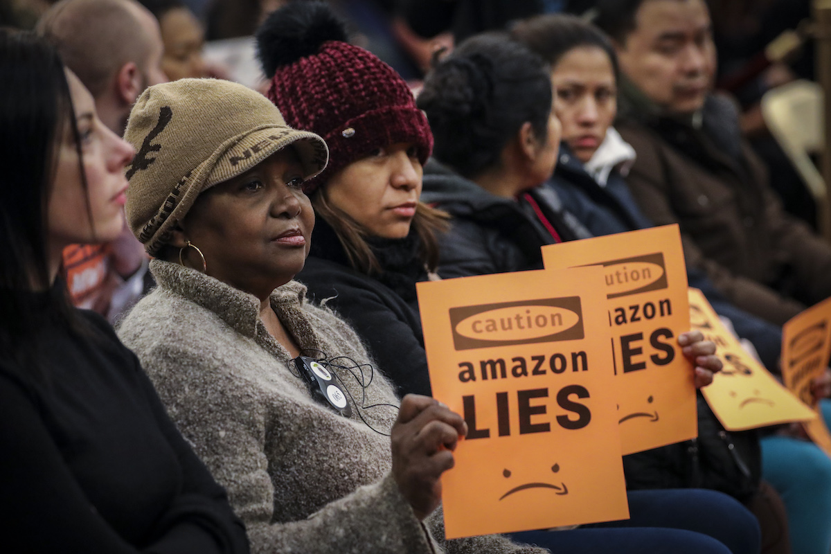 protesters at a city council meeting