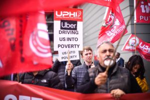 uber drivers carrying protest signs