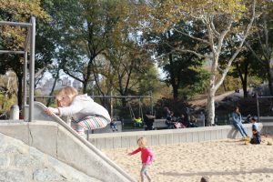 child playing on a slide