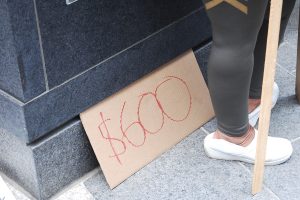 Cardboard sign reading "$600"